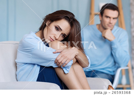 Moody yong woman sitting at home 26593368