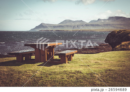 Wooden table and benches in resting area 26594689