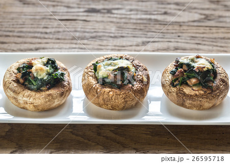 Baked mushrooms stuffed with spinach and cheese Baked mushrooms stuffed with spinach and cheese 26595718