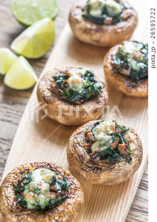Baked mushrooms stuffed with spinach and cheese Baked mushrooms stuffed with spinach and cheese 26595722