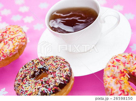 Cup of tea for breakfast with donuts in motion 26598150