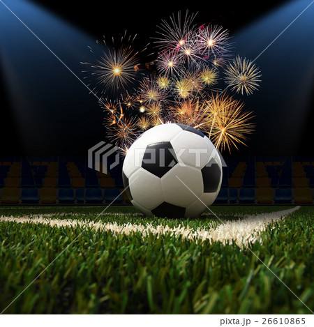 soccer ball on the green field 26610865