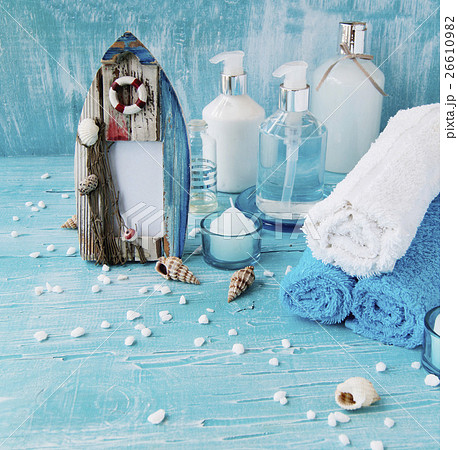 White flowers lying on and candle Spa set White flowers lying on and candle Spa set 26610982