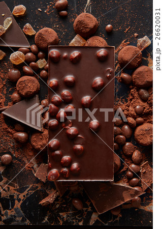 Chocolate and sweets isolated on black 26620031
