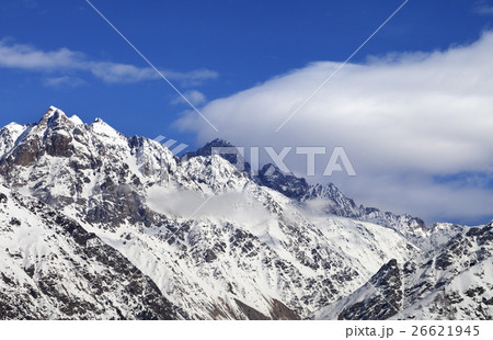 Snow winter mountains and blue sky with clouds 26621945
