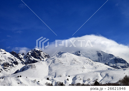 Mountains in clouds and off-piste slope in winter 26621946