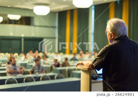 Senior public speaker giving talk at scientific Senior public speaker giving talk at scientific 26624901