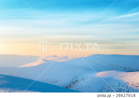 Sunset over hills with snow Sunset over hills with snow 26627018