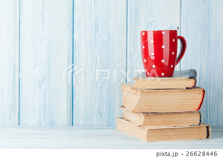 Hot chocolate cup on books 26628446