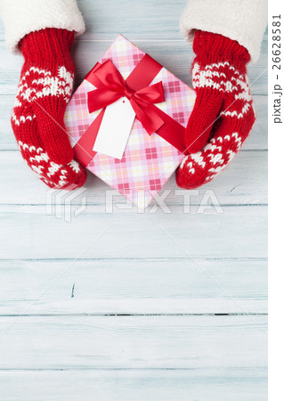 Female hands holding christmas gift 26628581