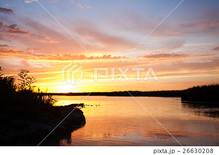 Sunset over water Sunset over water 26630208