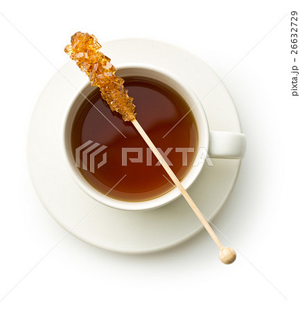 Brown amber sugar crystal on wooden stick. Brown amber sugar crystal on wooden stick. 26632729