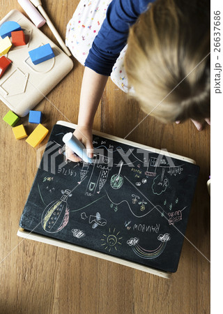 Little Girl Drawing Blackboard Concept 26637686