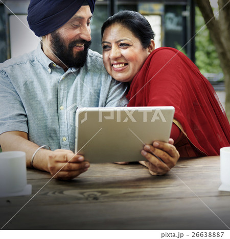 Indian Couple Using Device Concept Indian Couple Using Device Concept 26638887