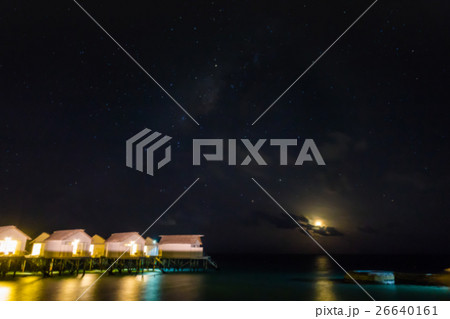 Abstract blur Milky Way over water villa cottages on Maldives . Abstract blur Milky Way over water villa cottages on Maldives . 26640161