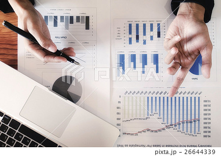 Business woman working at office with documents Business woman working at office with documents 26644339