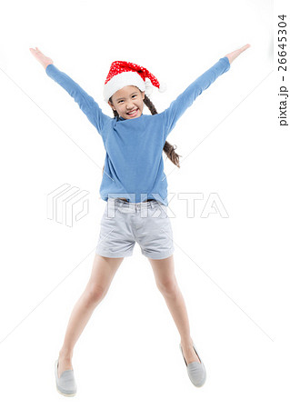 Happy Asian girl with santa hat jumping on isolate Happy Asian girl with santa hat jumping on isolate 26645304