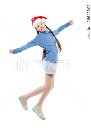 Happy Asian girl with santa hat jumping on isolate Happy Asian girl with santa hat jumping on isolate 26645305