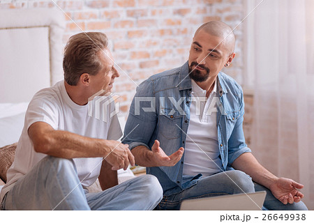 Involved friends discussing the topic at home 26649938