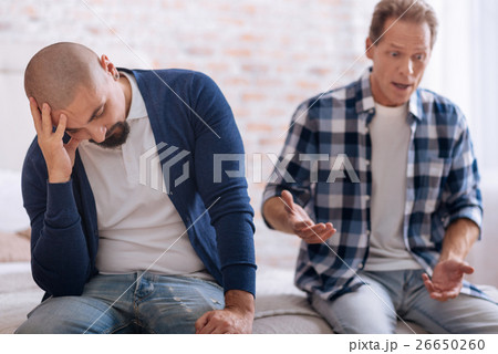 Irritated homosexual couple quarrelling with each Irritated homosexual couple quarrelling with each 26650260
