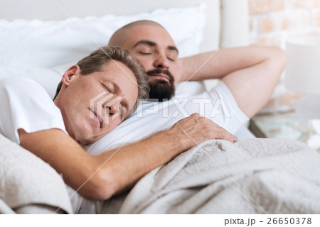 Pleasant non-traditional couple sleeping in the Pleasant non-traditional couple sleeping in the 26650378