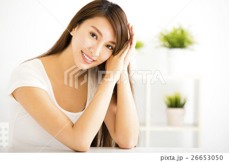 young smiling woman in living room young smiling woman in living room 26653050