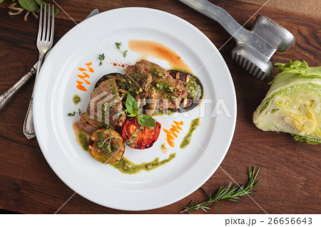 veal medallions with grilled vegetables 26656643