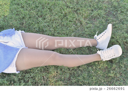 Hop and legs in jeans and legging belongs to girl. Hop and legs in jeans and legging belongs to girl. 26662691