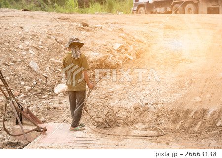 Worker on pontoon hold prestressed concrete wire Worker on pontoon hold prestressed concrete wire 26663138
