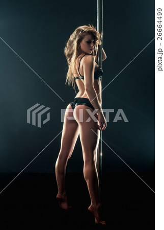 Pole dance. Shot of sexy dancer with elastic ass 26664499