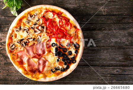 Assorted Pizza with bacon, mushrooms, peppers and Assorted Pizza with bacon, mushrooms, peppers and 26665680