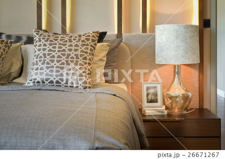 luxury bedroom with white lamp on wooden table 26671267