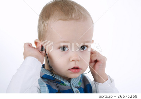 cute boy listens music with headphones cute boy listens music with headphones 26675269