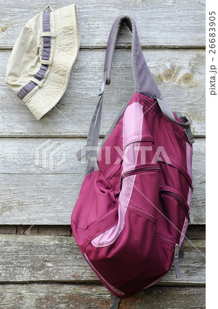Khaki Hat and Purple Backpack 26683905