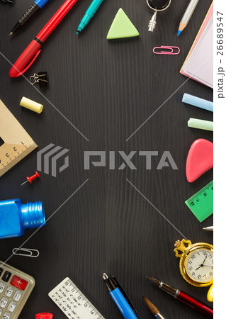 school supplies on black wood 26689547