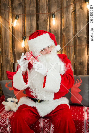 Santa Claus: Cheerful With Small Stack Of Gifts Santa Claus: Cheerful With Small Stack Of Gifts 26689587