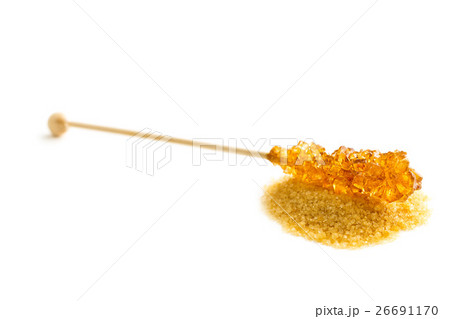 Brown amber sugar crystal on wooden stick. Brown amber sugar crystal on wooden stick. 26691170
