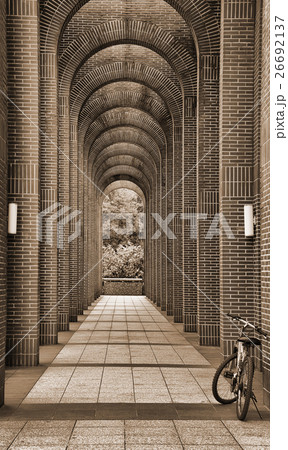 A bike Leaning on an arch corridor A bike Leaning on an arch corridor 26692137