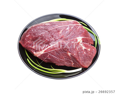 Piece of raw beef isolated on white background 26692357