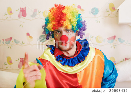 Clown in funny costume show finger. Clown in funny costume show finger. 26693455
