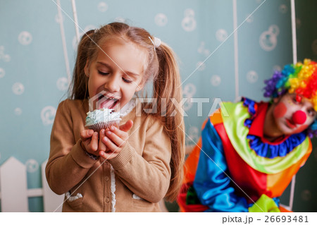 Girl eating birthday cake. 26693481