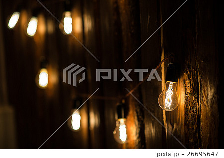 Vintage incandescent Edison type bulbs on wooden 26695647