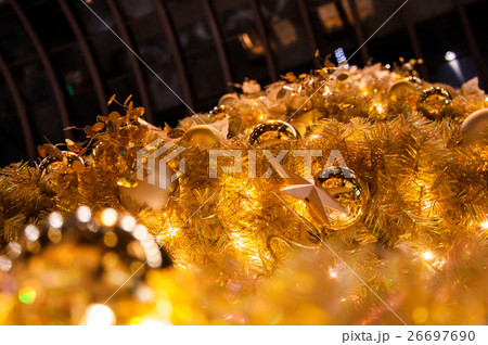 Closeup decorated gold and yellow Christmas tree Closeup decorated gold and yellow Christmas tree 26697690