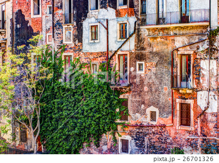 red vintage old brick wall with windows and green 26701326