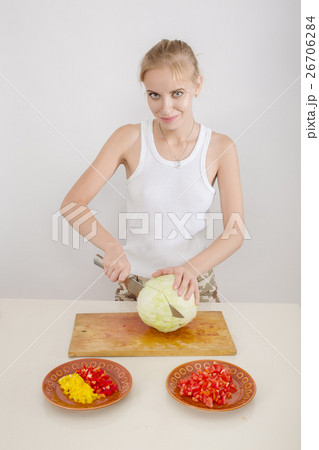 woman cutting cabbage 26706284