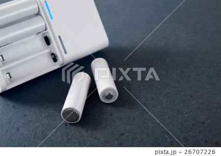 Battery charger on a stone countertop Battery charger on a stone countertop 26707226