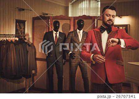 Extravagant stylish man in tailor studio Extravagant stylish man in tailor studio 26707341