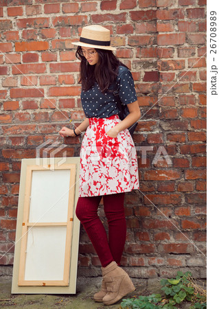 Young Asian woman with painting 26708989