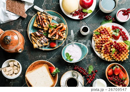 Breakfast table with waffles Breakfast table with waffles 26709547