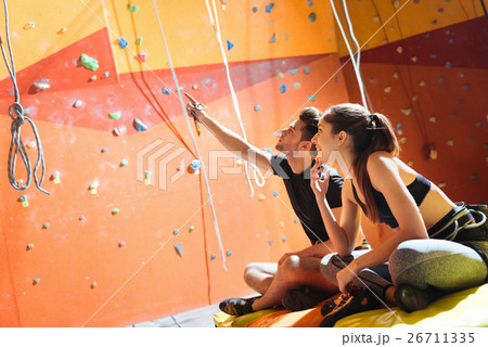 Happy couple sitting in a climbing gym 26711335